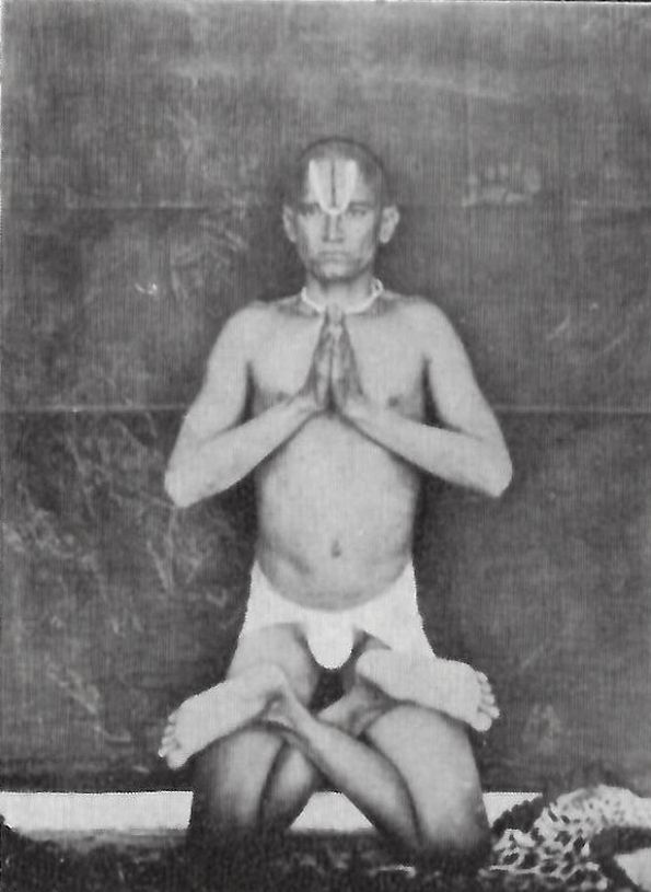 Shri Veer Raghavacharya Ji seated in namaskāra, an archival photograph