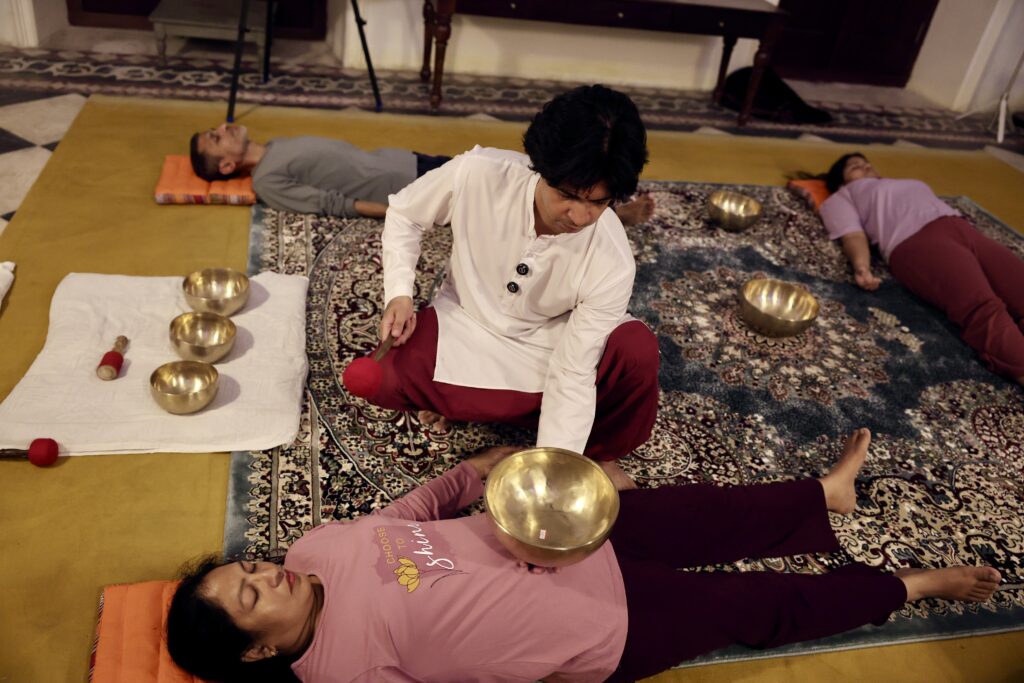 Group Hatha yoga class in the ashram hall